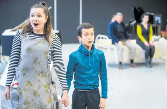  ?? Photos / Jason Oxeham, Michael Bradley ?? Olivia Forbes, 18, left, and Lukas Maher, 12, rehearse. Below: Anna Leese — is she playing with fire in The Turn of the Screw?