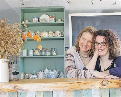  ?? MILLICENT MCKAY/JOURNAL PIONEER ?? July Edgcomb, left, and Courtney Gallant get behind the serving counter in the Leard House. The café, located at 2904 Route 112, Lower Bedeque, will soon be opening for its second season.