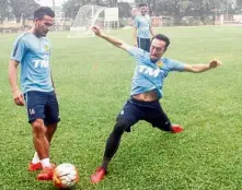  ??  ?? Stretching: National goalkeeper Khairul Fahmi Che Mat going for the ball as Wan Zack Haikal is about to pass during training at Wisma FAM yesterday. — M. AZHAR ARIF/ The star