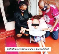  ??  ?? SEKURU Hwesa (right) with a disabled child