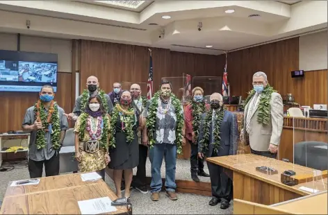  ?? The Maui News / LILA FUJIMOTO photos ?? Graduates and 2nd Circuit Court judges pose for a photo after the 72nd graduation ceremony for the Maui Drug Court program, which is in its 20th year. From right are 2nd Circuit Chief Judge Richard Bissen, who serves as Drug Court judge, retired 2nd Circuit Chief Judge Joseph Cardoza, 2nd Circuit Judge Rhonda Loo, Joseph Kaikala, Robert Kaikala, Desiree Collier, 2nd Circuit Judge Peter Cahill, Michael Woods, Starr Begley and Kianu Pelekai-Peneku.