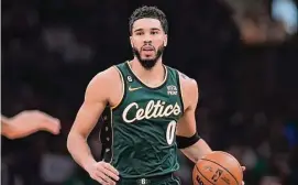  ?? Steven Senne/Associated Press ?? Boston Celtics forward Jayson Tatum plays against the Memphis Grizzlies on Sunday in Boston.
