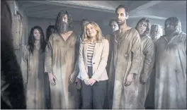  ?? CBS VIA AP ?? Rose McIver, center, in a scene from the comedy series “Ghosts.”