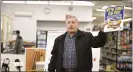  ??  ?? County Commission­er Christian Leinbach speaks (holding a sign that is part of a campaign they are starting to promote safe shopping) during a press conference at the Weaver’s Hardware April 16.