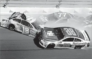  ?? Jeff Siner Charlotte Observer ?? SEVERAL PROMINENT DRIVERS were involved in a crash in Turn 3 during the Daytona 500, including Dale Earnhardt Jr. (88), Kyle Busch (18), Erik Jones (77) and Matt Kenseth (20).