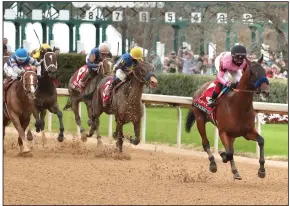  ?? (The Sentinel-Record/Richard Rasmussen) ?? Jockey Joel Rosario and Concert Tour coast home to an easy victory in the Rebel Stakes on Saturday at Oaklawn.