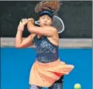  ??  ?? Naomi Osaka came back from 3-5, 15-40 down in the final set to beat Garbine Muguruza.