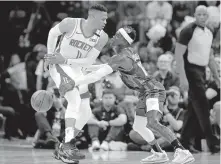  ?? OKLAHOMAN] ?? Dennis Schroder (17) swipes the ball away from Russell Westbrook (0) during the Thunder’s 113-92 win over the Rockets on Jan. 9 at Chesapeake Energy Arena in Oklahoma City. [SARAH PHIPPS/ THE