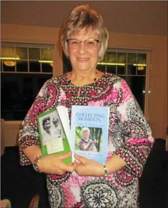  ?? PHOTO SPECIAL TO THE DISPATCH BY MIKE JAQUAYS ?? Author and retired registered nurse Jeanne Dunn poses with her books “Where Once There Were Thorns” and “Collecting Moments: A Gathering of Poems & Paintings” during a presentati­on to the Oneida-Sherrill Lions Club on Dec. 12at the Lakeview Restaurant...