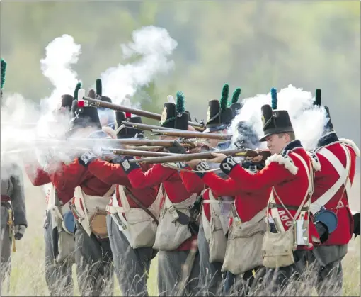  ?? GEOFF ROBINS/ POSTMEDIA NEWS ?? The Americans had designs on controllin­g Canadian decision- making in 1812, depicted in this re- enactment in London, Ont. Two hundred years later, we are facing similar issues with Enbridge’s Northern Gateway pipeline proposal.