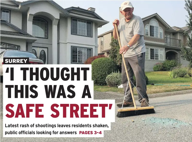  ?? JENNIFER SALTMAN/PNG ?? Andy Daniel sweeps up glass Wednesday in front of his house in the 15900-block 89A Avenue in Surrey, where a man was wounded in a shooting Tuesday.