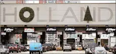  ?? JULIO CORTEZ/AP ?? Motorists complain that the Holland Tunnel wreaths just don't look right. A poll gives motorists four new options.