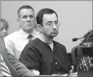  ?? AP/CARLOS OSORIO ?? Larry Nassar sits Wednesday at his sentencing hearing in Lansing, Mich., for the sexual abuse of dozens of women and girls.