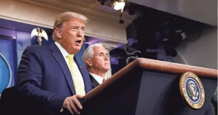  ?? PATRICK SEMANSKY/AP ?? President Donald Trump, joined by Vice President Mike Pence, said Monday that a “very dramatic” stimulus was needed to stanch markets spooked by the coronaviru­s. He had been hailing the strength of the economy.