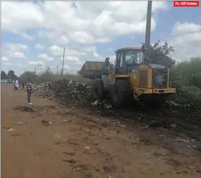  ?? ?? A Harare City Council front-end loader clearing garbage in Dzivarasek­wa yesterday
Pic: Cliff Chiduku