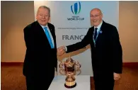  ?? AFP ?? Chairman of World Rugby Bill Beaumont (left) shakes hands with French rugby president Bernard Laporte on Wednesday. —