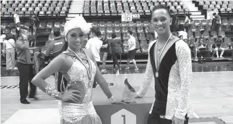  ?? CHERRY CLARICE PARCON ?? DANCESPORT CHAMPS. Cherry Clarice Parcon and Gerald Jamili pose during a tournament in Manila.