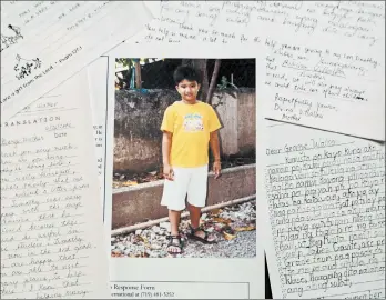  ?? COMPASSION INTERNATIO­NAL ?? Former President George H.W. Bush sponsored Timothy, then 7, for 10 years. Above, a photo of Timothy with a letter he sent to his pen pal. The 41st president died last month.