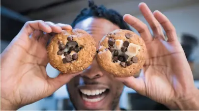  ?? CP PHOTO ?? Yannick Craigwell shows off some of his edible marijuana baked treats in Vancouver on Wednesday.