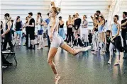  ??  ?? Oklahoma City Ballet soloist Amy Potter warms up to rehearse an act of “Swan Lake” on Monday after a news conference to announce a $2 million gift to the ballet from the Kirkpatric­k Philanthro­pies at the new Susan E. Brackett Dance Center in Oklahoma...