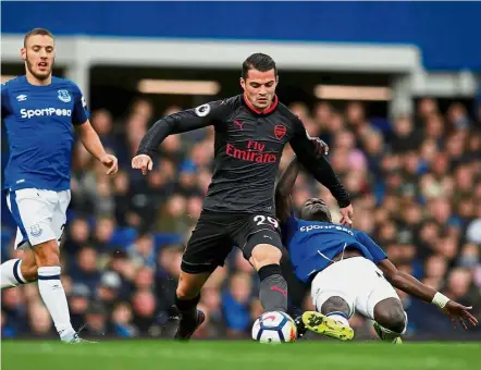  ??  ?? Ready for the kill: Granit Xhaka (centre) says that leaders Manchester City could slow down and Arsenal must capitalise when they do.