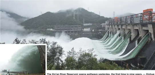  ??  ?? The Xin’an River Reservoir opens spillways yesterday, the first time in nine years. — Xinhua