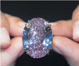  ?? /Reuters ?? Sparkles galore: Hong Kong jewellery retailer Chow Tai Fook made the $71.16m winning bid at auction for the flawless 59.60-carat mixed-cut diamond known as The Pink Star.