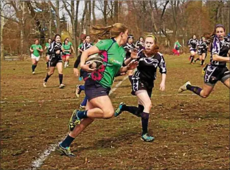  ?? SUBMITTED PHOTO ?? Phoenixvil­le White Horse Women’s Rugby Club players chase an opposing player during competitio­n.