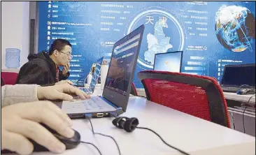  ??  ?? Workers monitor laptops at the command center of Chinese e-commerce giant JD.com during ‘Singles Day’ in Beijing, China yesterday.