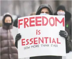  ?? GRAHAM hughes / THE CANADIAN PRESS FILES ?? People protest in Montreal back in November against measures taken by public health authoritie­s
to curb the spread of COVID-19.