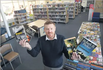  ??  ?? READY TO LAUNCH: Yarriambia­ck Shire Council youth and library officer Justin Knorpp sets up for borrowing at Warracknab­eal Library. Yarriambia­ck Libraries will operate Warracknab­eal Library with outreach libraries at Beulah, Hopetoun, Minyip, Murtoa, Patchewoll­ock, Rupanyup and Woomelang.
Picture: PAUL CARRACHER