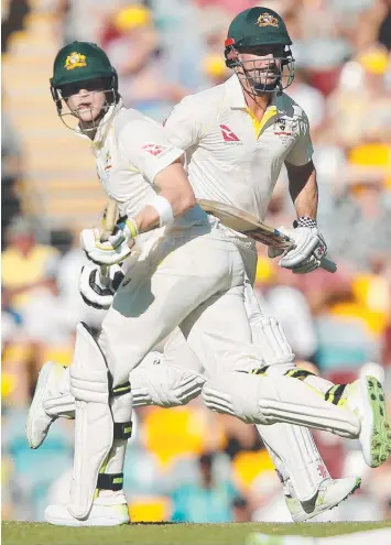  ?? Picture: JONO SEARLE/AAP ?? RESOLUTE: Steve Smith (left) and Shaun Marsh shared an unbeaten 89-run stand yesterday as the Aussies reduced England’s lead to 137 on day two of the first Ashes Test.