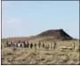  ?? SUSAN MONTOYA BRYAN — THE ASSOCIATED PRESS FILE ?? Some 250 people line the fence line at the Petroglyph National Monument near Albuquerqu­e, N.M.,