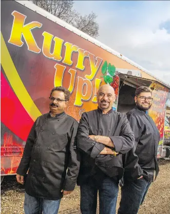  ?? GAVIN YOUNG ?? Jassie Bakshi, with his son Sunny, right and chef Gary Singh, left, in front of their Kurry Up! food truck. The mobile kitchen has a staggering 65 items on the menu.