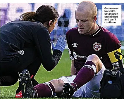  ??  ?? Game over: Naismith sits injured on the turf and can’t continue