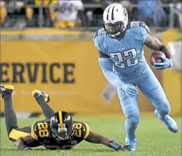  ?? Matt Freed/Post-Gazette ?? Tennessee’s Derrick Henry, right, breaks away from Sean Davis in the Steelers’ most recent game. Said Mike Tomlin — “We’re not going to be a dominant group until we minimize big plays and we tackle better.”