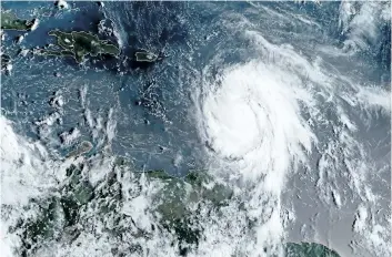  ?? GETTY IMAGES ?? This satellite image obtained from the National Oceanic and Atmospheri­c Administra­tion shows hurricane Maria on Monday. Maria is menacing Caribbean islands already hard-hit by hurricane Irma.