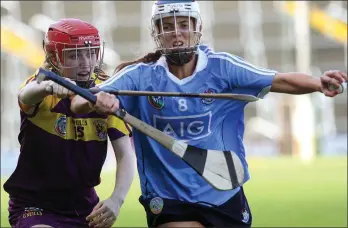  ??  ?? Wexford’s Amy Cardiff challenges Eimear McCarthy of Dublin.