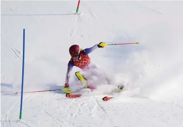  ?? Robert F. Bukaty / Associated Press ?? Mikaela Shiffrin skis out in the first run of the women's slalom after missing a gate seconds into her race.