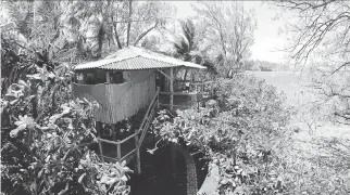  ?? BEN NEWTON/FOR THE WASHINGTON POST ?? The tree houses at Mandala Island Resort have mosquito netting.