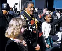  ?? ROGELIO V. SOLIS/THE ASSOCIATED PRESS ?? Myrlie Evers, center, civil rights activist and widow of civil rights leader Medgar Evers, is escorted Saturday to the entrance of the Museum of Mississipp­i History and the Mississipp­i Civil Rights Museum.