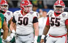  ?? CURTIS COMPTON/ CCOMPTON@ AJC. COM ?? Georgia offensive linemen Warren Ericson ( left) and Trey Hill work against Baylor in the Sugar Bowl on Jan. 1. With Hill, a longtime starter at center, undergoing knee surgery, Ericson could replace him Saturday against Missouri.