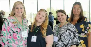  ??  ?? DeAnn Hunt, Arkansas Down Syndrome Associatio­n, and Mia Stark, Community Health Centers, with Goodwill representa­tive Kerri Nettles and Jennifer Francomano