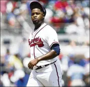  ?? CHAD RHYM / CHAD.RHYM@AJC.COM ?? Braves reliever Jose Ramirez exits after working one-third of an inning against the Cubs. He gave up two hits, including a long homer by Javier Baez.