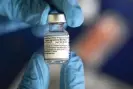  ?? Rogelio V Solis/AP ?? A vial of Pfizer’s Covid vaccine. Photograph: