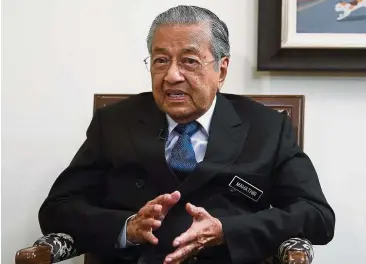  ??  ?? Limited funds: Dr Mahathir has reiterated that the country cannot afford some of the Chinese projects. — Bernama