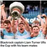  ??  ?? Blackrock captain Liam Turner lifts the Cup with his team-mates