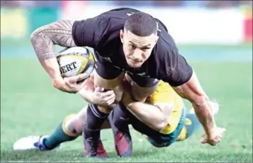 ?? WILLIAM WEST/AFP ?? New Zealand centre Sonny Bill Williams is tackled during the All Blacks’ Rugby Championsh­ip Test match against Australia in Sydney on Saturday.