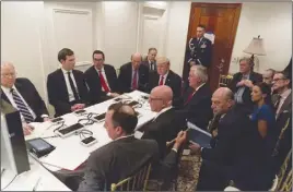  ?? AP PHOTO ?? President Donald Trump receives a briefing at Mar-a-Lago in Palm Beach, Fla., on the Syria military strike from his National Security team.