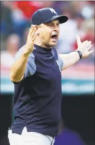  ?? Ron Schwane / Associated Press ?? Yankees manager Aaron Boone seems to be overthinki­ng things lately says Register columnist Chip Malafronte.
